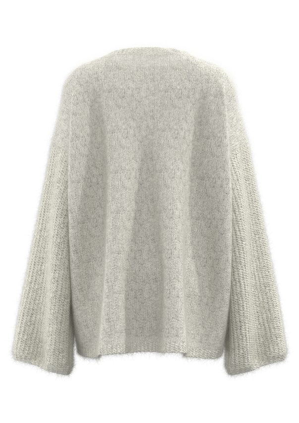 سترة نسائية بياقة دائرية وكتف منسدل